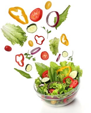 Falling fresh vegetables. Healthy salad